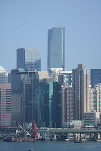 Modern buildings in city against clear sky