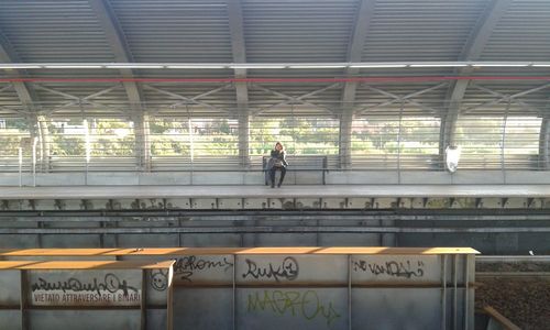 People walking on railroad station platform