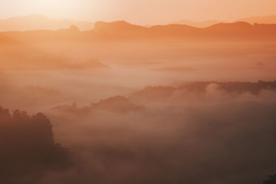 Scenic view of mountains against sky during sunset