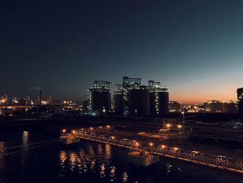 Illuminated buildings in city at night