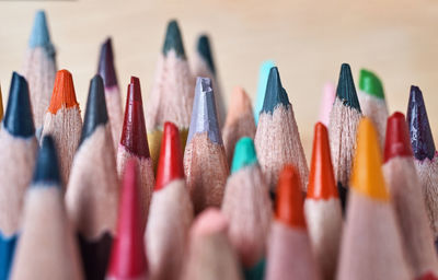 Close-up of colored pencils against white background