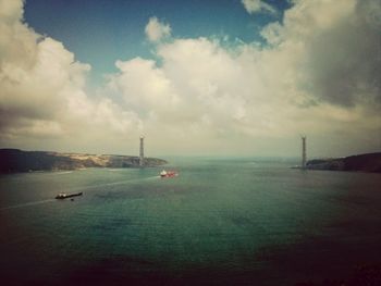 Scenic view of sea against cloudy sky