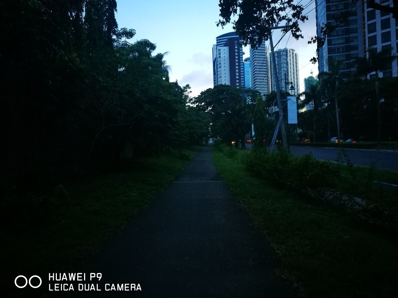 ROAD AMIDST BUILDINGS IN CITY