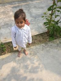 High angle view of cute girl standing outdoors