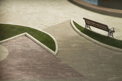High angle view of empty bench in park