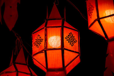 Low angle view of illuminated lanterns hanging on ceiling