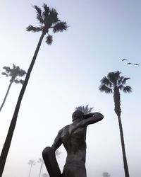 Low angle view of statue against sky
