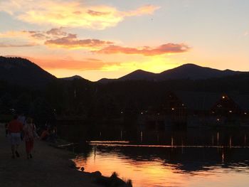 Scenic view of lake at sunset