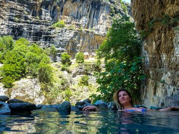 Woman relaxing in pond