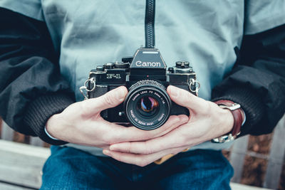 Midsection of man photographing