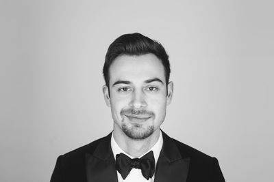 Portrait of young man against white background