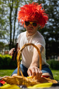 Portrait of a young man with beer celebrating belgium day.