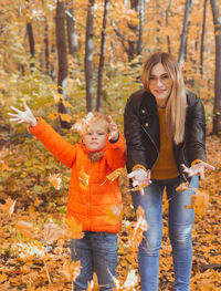 Portrait of mother and child during autumn