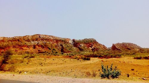 Scenic view of desert against clear sky