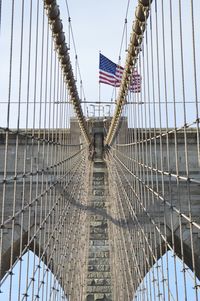 Low angle view of flag on bridge