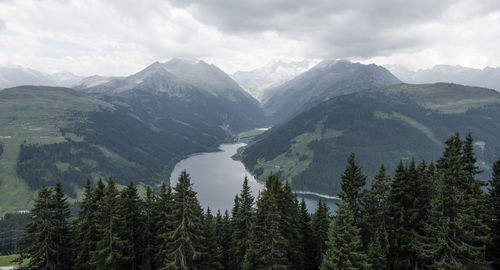 Scenic view of mountains against cloudy sky