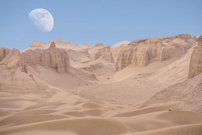 Scenic view of arid landscape against sky