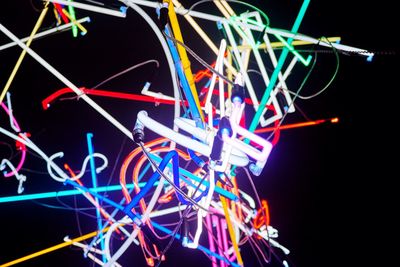 Illuminated ferris wheel at night