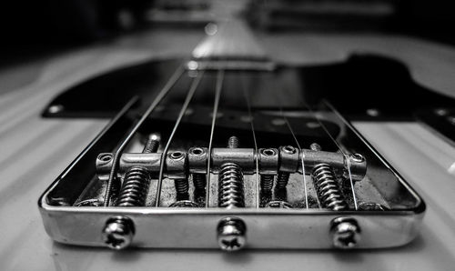 Close-up of guitar on table