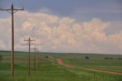 Scenic view of farm against sky