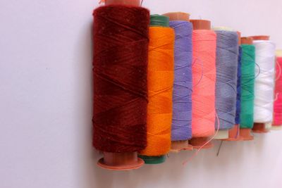 Close-up of multi colored candies against white background