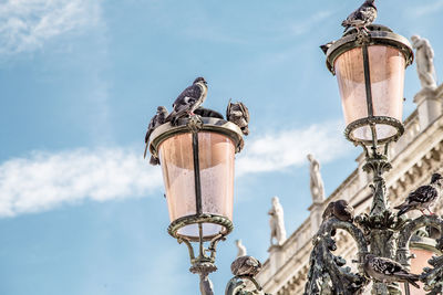 Low angle view of street light against sky