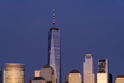 Low angle view of skyscrapers against clear sky