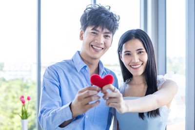 Portrait of a smiling young couple
