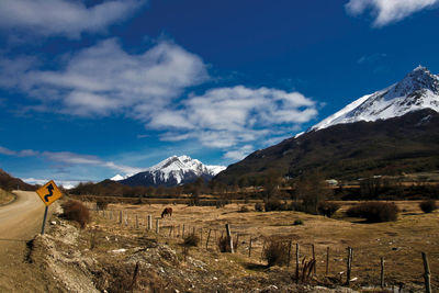 Scenic view of snowcapped mountains against sky