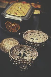 High angle view of antique containers on table