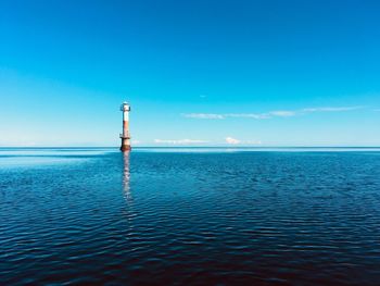 Scenic view of sea against blue sky