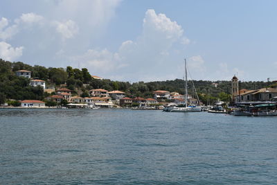 Boats in sea against sky