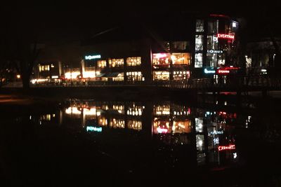 Reflection of illuminated buildings in water