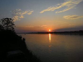 Scenic view of sunset over river