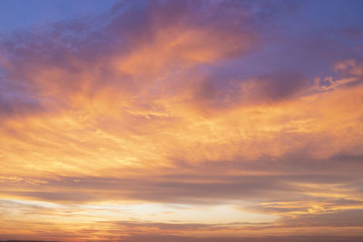 Low angle view of dramatic sky during sunset