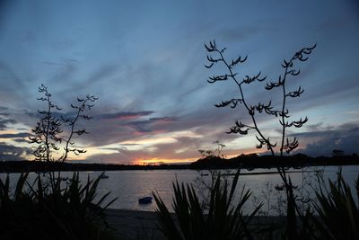 Scenic view of lake against sky during sunset