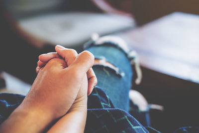 Close-up of couple holding hands