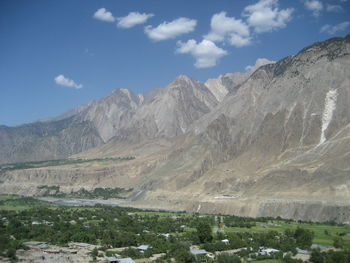 Scenic view of mountains against cloudy sky