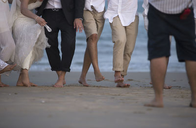 Low section of friends standing outdoors