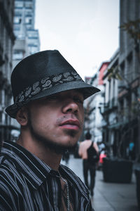 Portrait of young man wearing hat