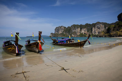 Boats moored at beach