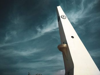 Low angle view of communications tower against sky