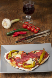 High angle view of pizza in plate on table