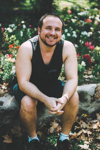 Portrait of young man sitting outdoors