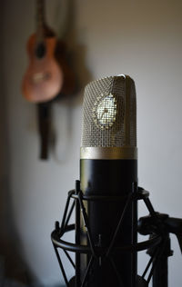 Close-up of microphone against white background