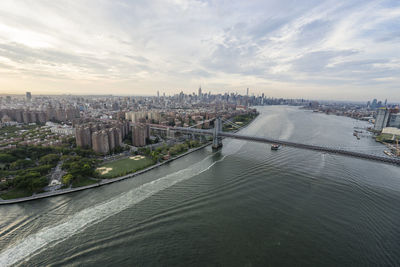 High angle view of williamsburg bridge over east river against sky