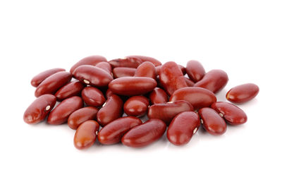 High angle view of coffee beans against white background