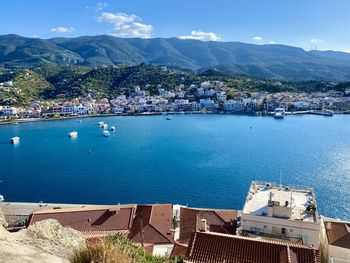 High angle view of sea and mountains against sky