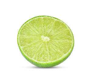 Close-up of lemon slice against white background