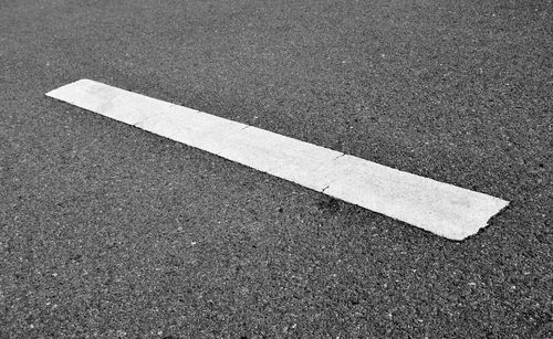 High angle view of arrow sign on road